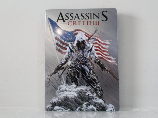 Assassin's Creed III game case with character and American flag on a gray background