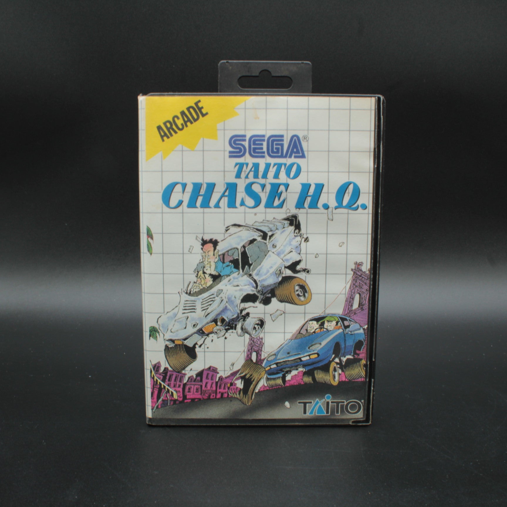 Sega Taito Chase H.O. arcade game cartridge packaging on a dark background rare arcade retro