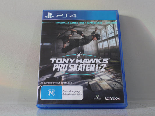 PS4 game case for 'Tony Hawk's Pro Skater 1+2' on a gray background